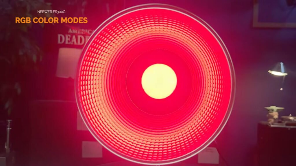 Close-up of a hand adjusting the rear control knob of the red GVM PRO SD300C LED light, with the LCD menu screen and DMX ports visible.