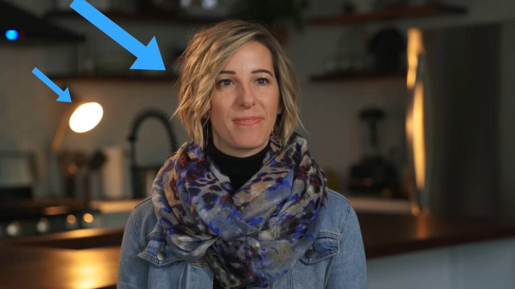 Example of motivated lighting setup for YouTube, showing how a background practical lamp justifies the warm rim light on the subject's shoulder.