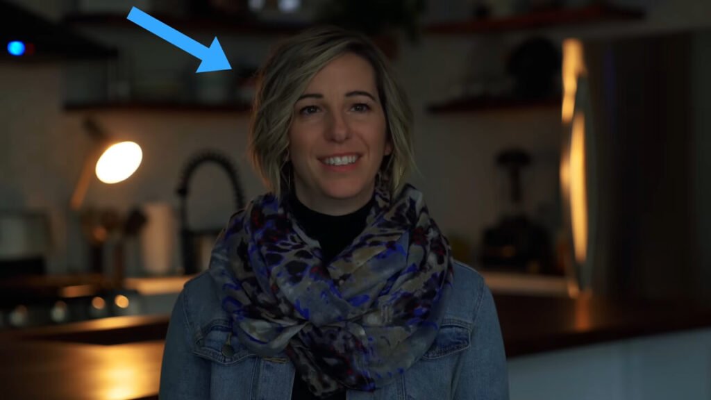 YouTube lighting setup example showing the motivated lighting technique, where a background practical lamp justifies the warm backlight on the subject.