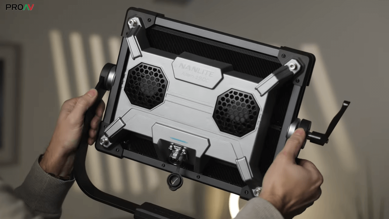 Rear view close-up of the Nanlite Alien 300C RGBWW LED Panel head, highlighting its active cooling fans, rugged metal yoke with locking knob, and lightweight separate head design.