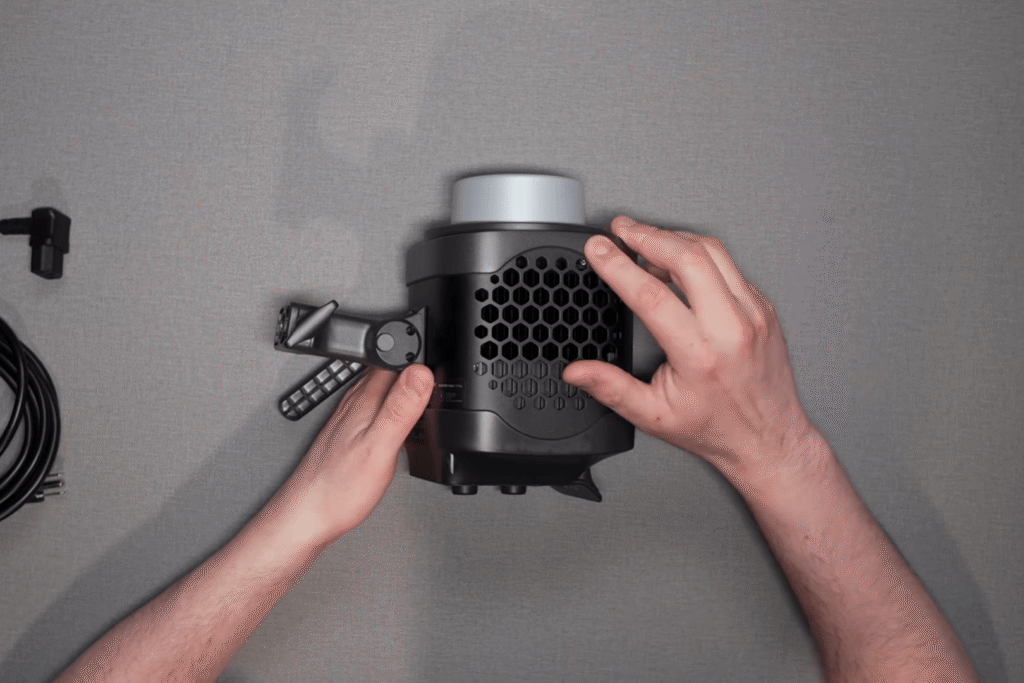 Independent gaffer inspecting the rear control panel and build quality of the Amaran 300x LED light.