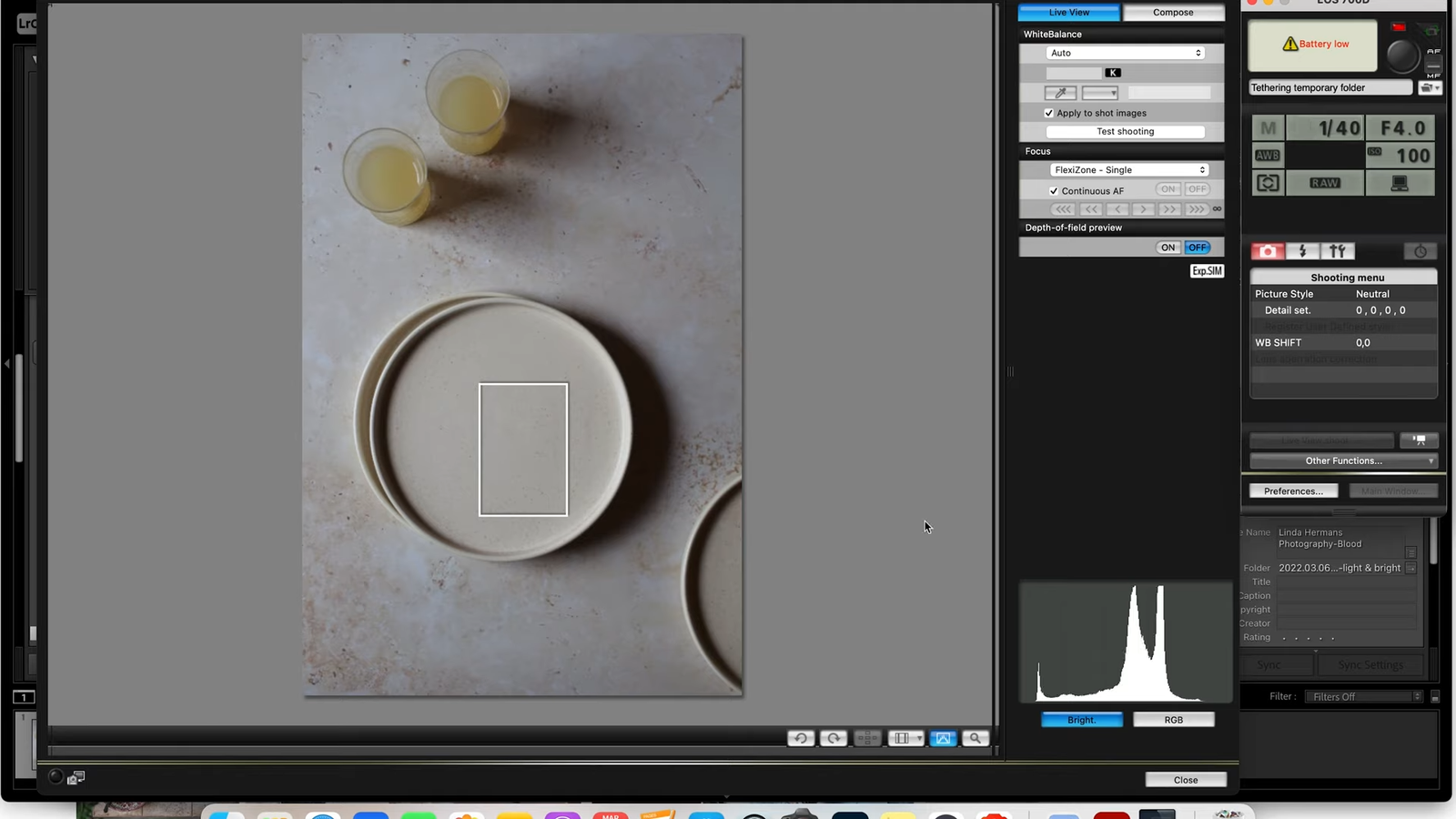 Food photography workstation with a computer for editing natural light images.