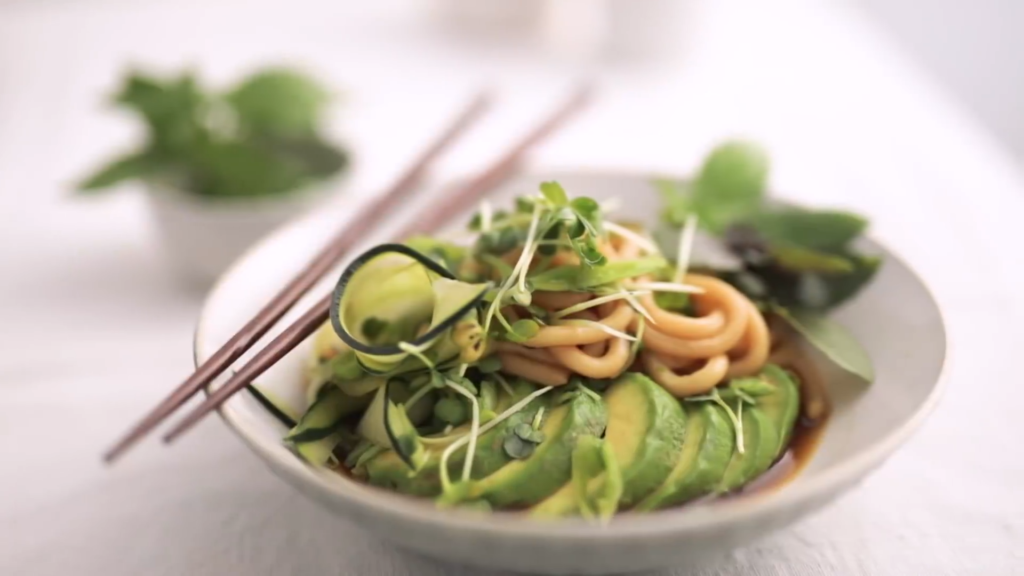 Close-up shot of fresh salad, beautifully lit with soft natural window light.